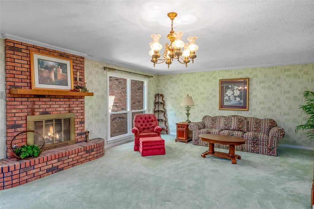741 Beverly Drive Homer, LA 71040 - Photo 7 of 30 a living room with furniture and a fireplace