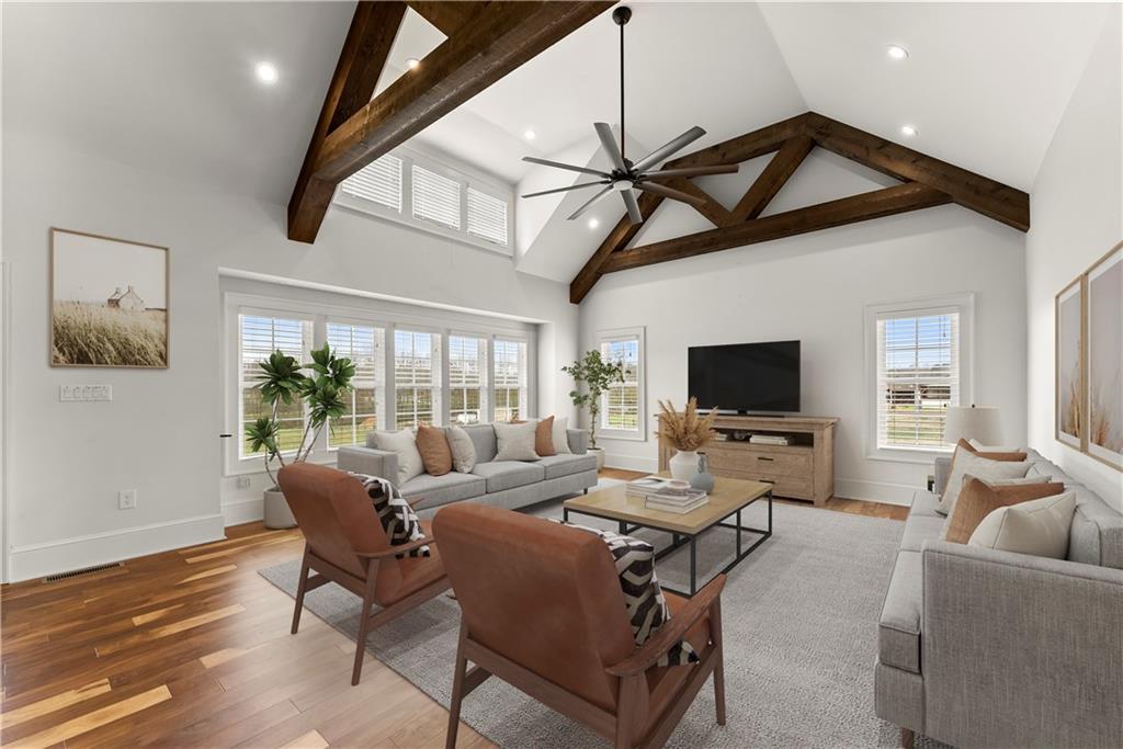 725 County Farm Road Jefferson, GA 30549 - Photo 11 of 66 a living room with furniture a ceiling fan and a flat screen tv