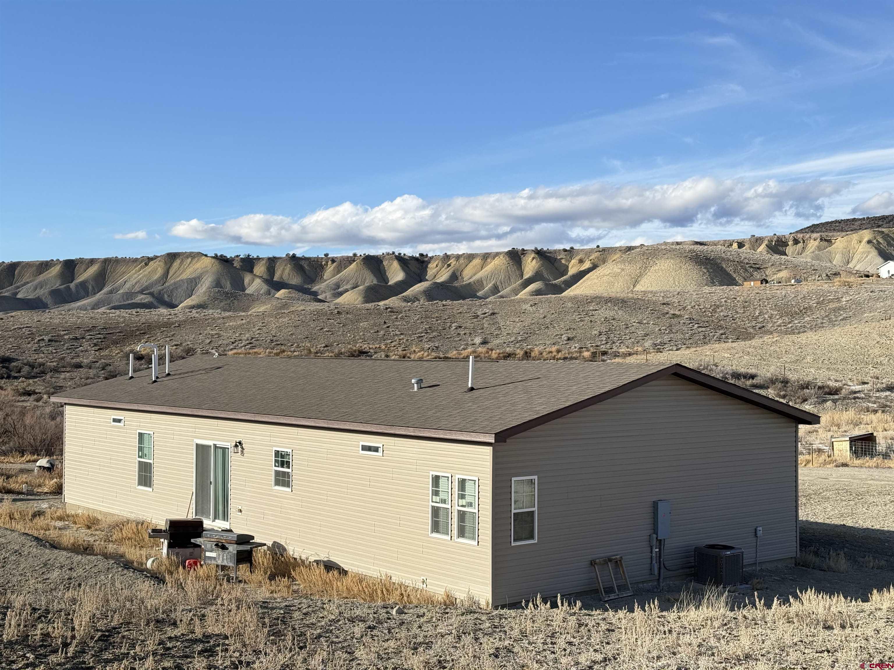 28454 Lampshire Road Hotchkiss, CO 81419 - Photo 13 of 45 a view of a house with a snow