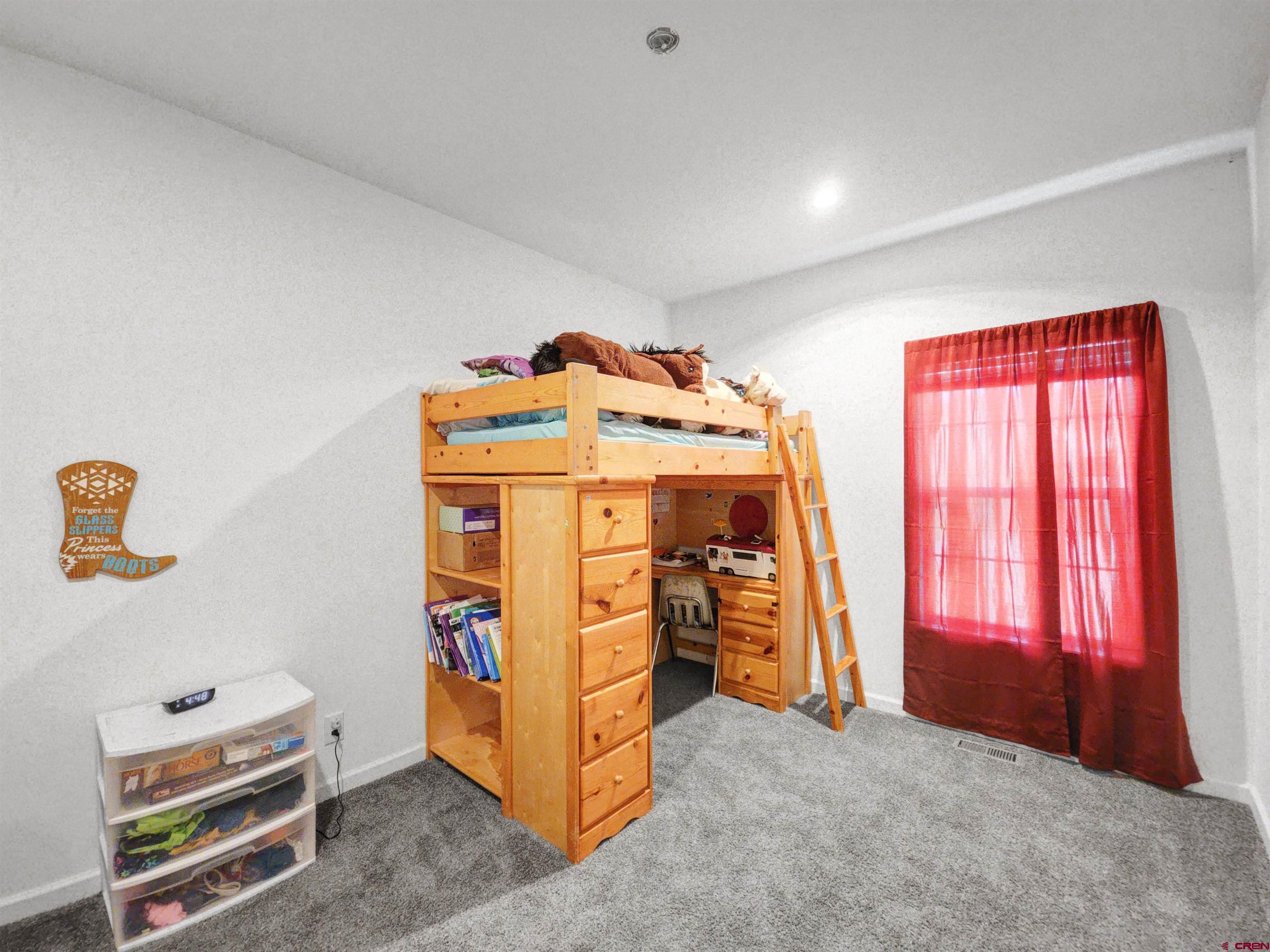 28454 Lampshire Road Hotchkiss, CO 81419 - Photo 25 of 45 an empty room with windows and closet