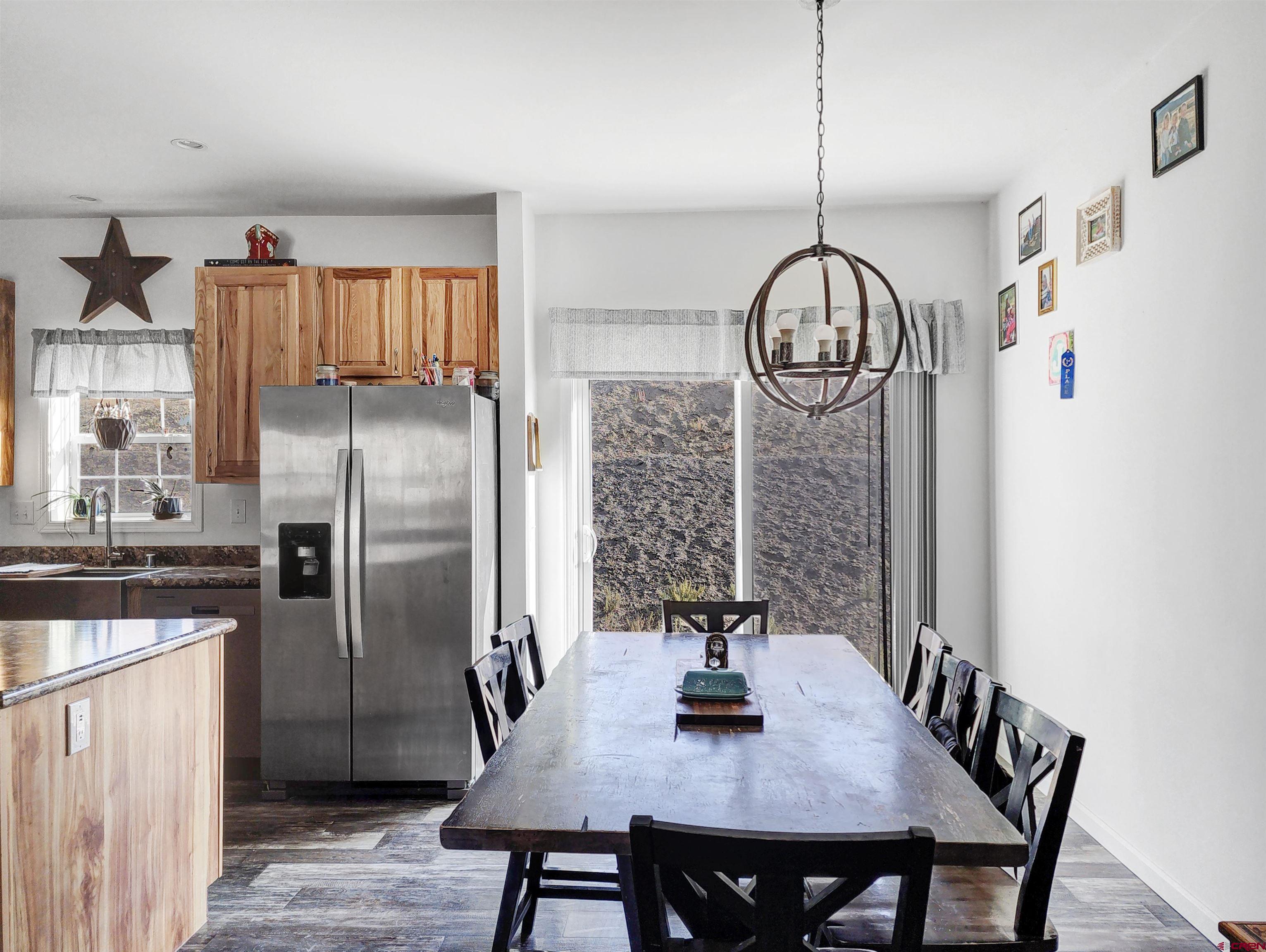 28454 Lampshire Road Hotchkiss, CO 81419 - Photo 7 of 45 a view of kitchen island with furniture and stainless steel appliances