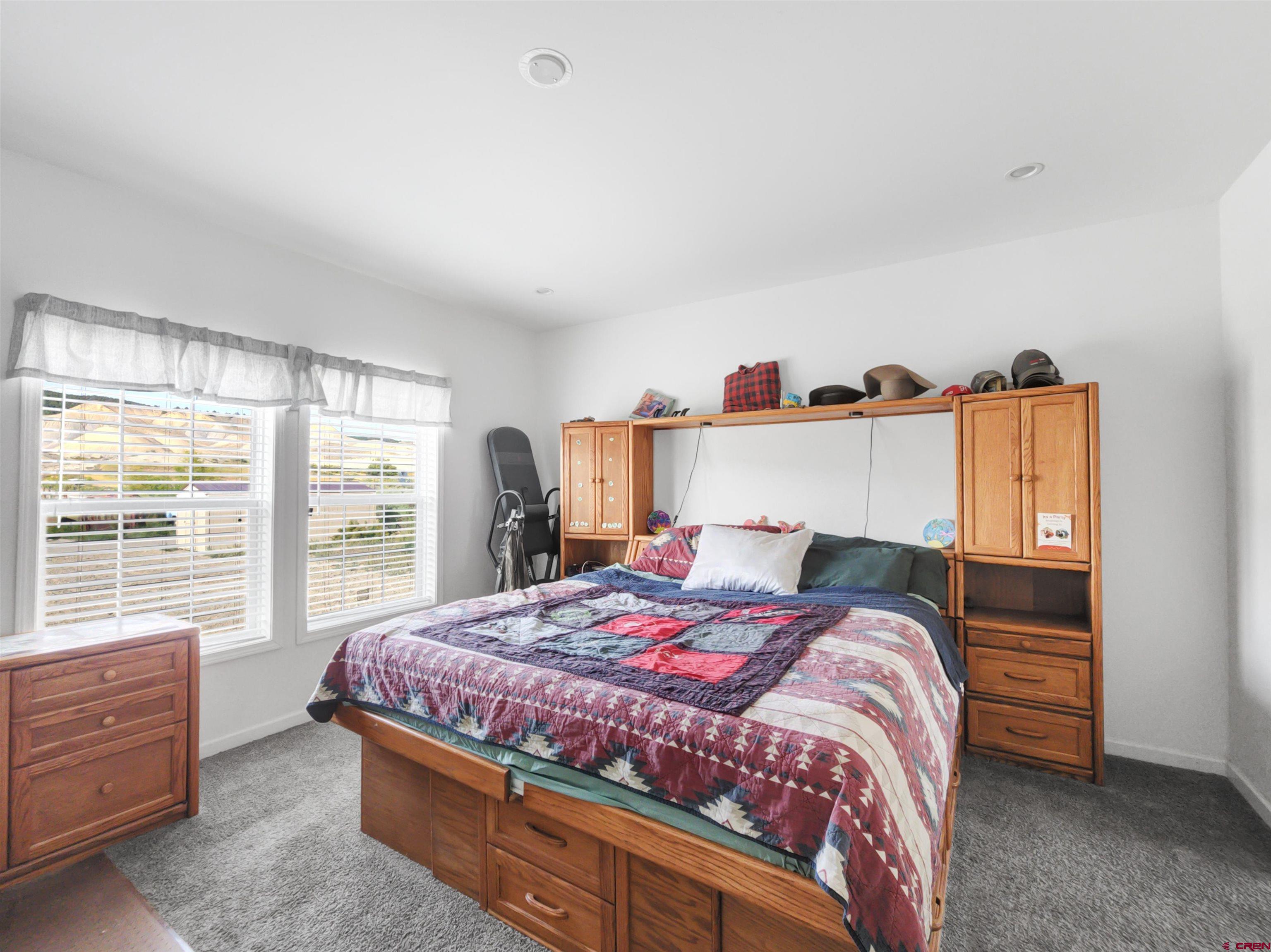 28454 Lampshire Road Hotchkiss, CO 81419 - Photo 10 of 45 a bedroom with a bed and a window