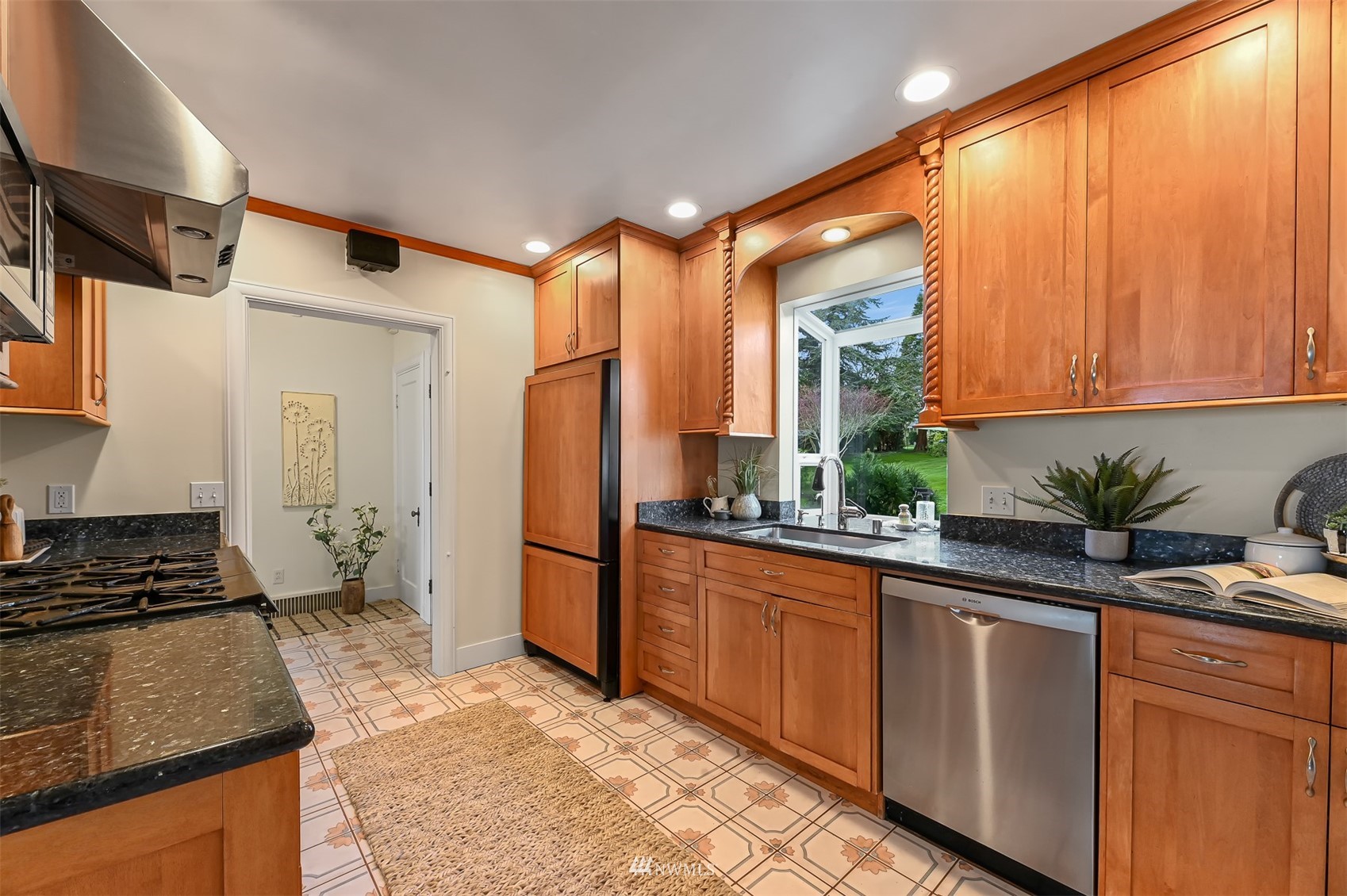 3796 Bancroft Road Bellingham, WA 98225 - Photo 11 of 38 a kitchen with granite countertop a stove a sink and a refrigerator