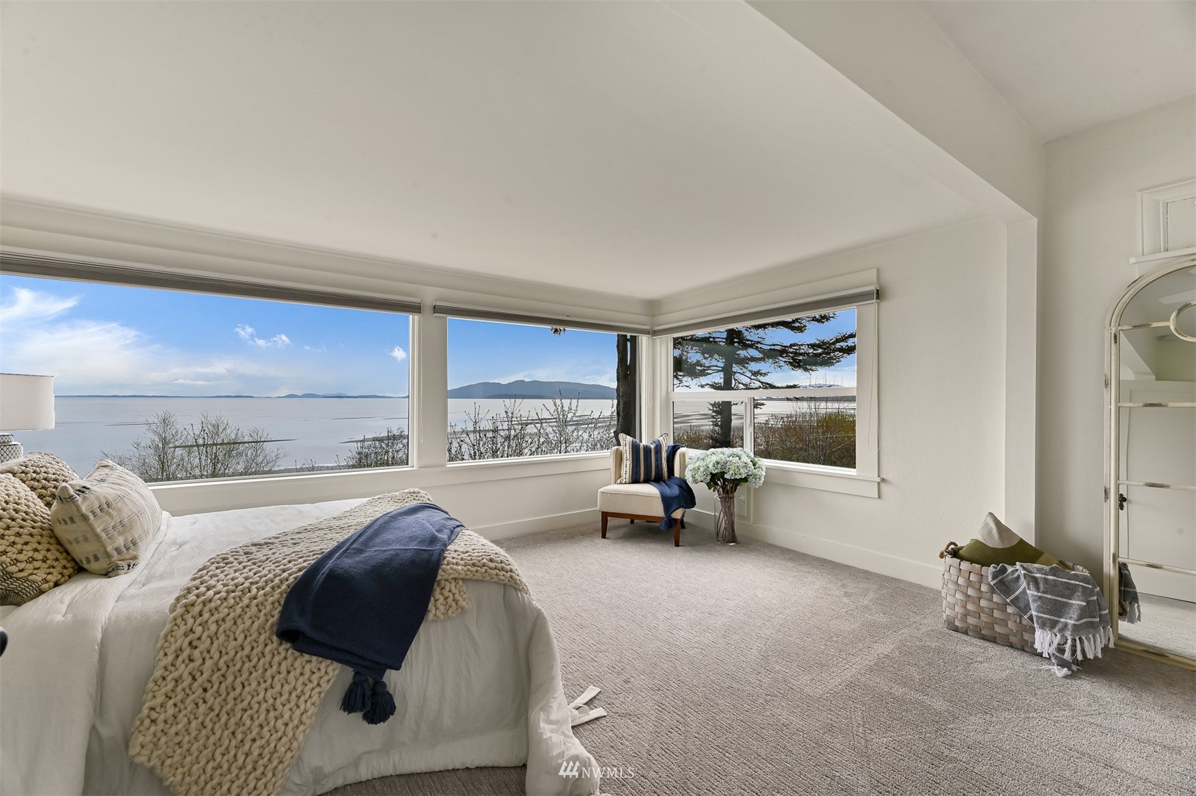 3796 Bancroft Road Bellingham, WA 98225 - Photo 14 of 38 a spacious bedroom with a large bed and a large window