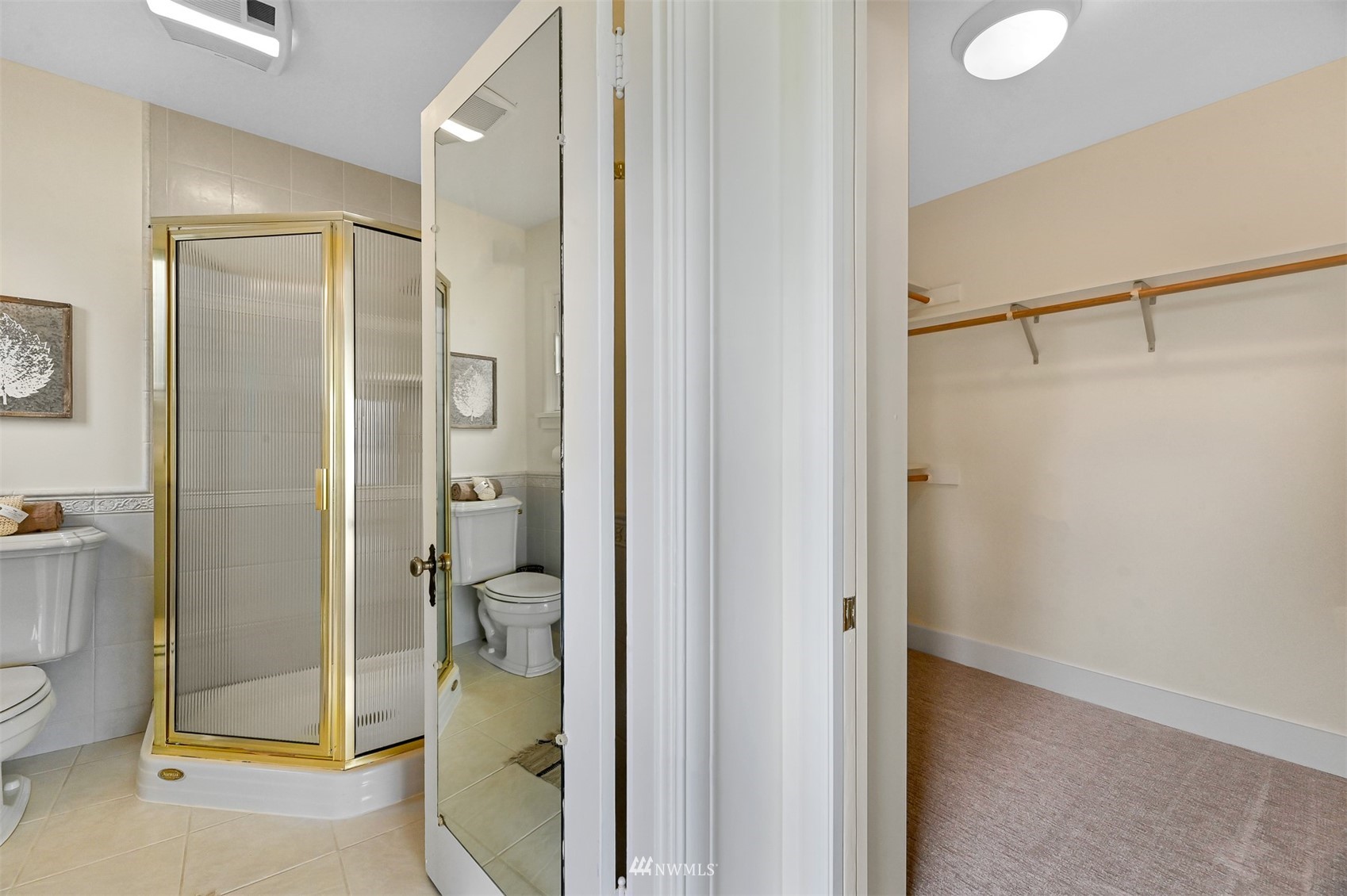 3796 Bancroft Road Bellingham, WA 98225 - Photo 17 of 38 a bathroom with a glass shower door and a sink