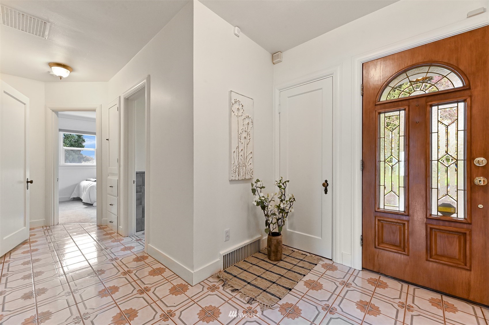 3796 Bancroft Road Bellingham, WA 98225 - Photo 19 of 38 a view of a hallway with wooden floor and a livingroom