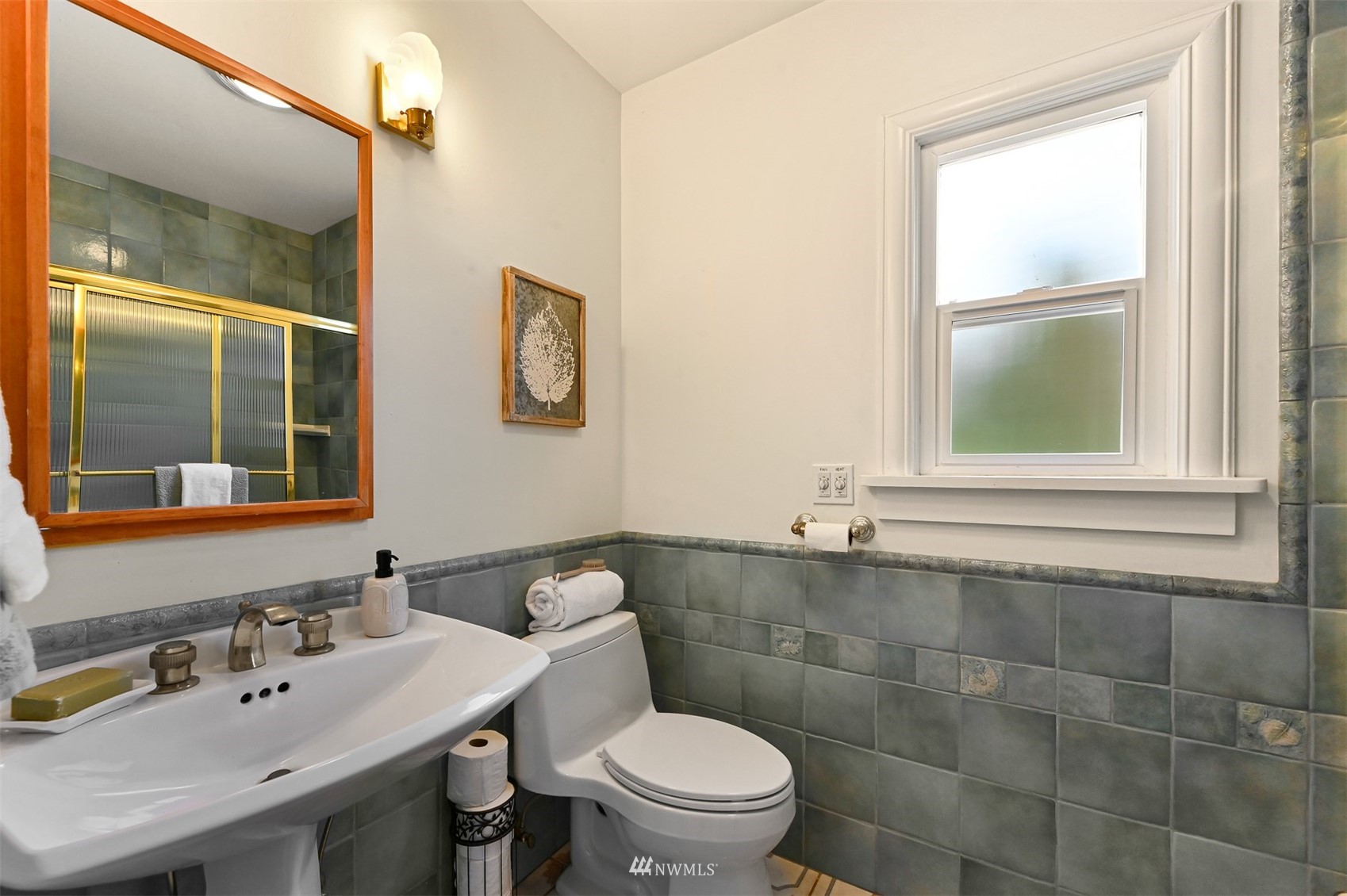 3796 Bancroft Road Bellingham, WA 98225 - Photo 20 of 38 a bathroom with a toilet a sink and a window