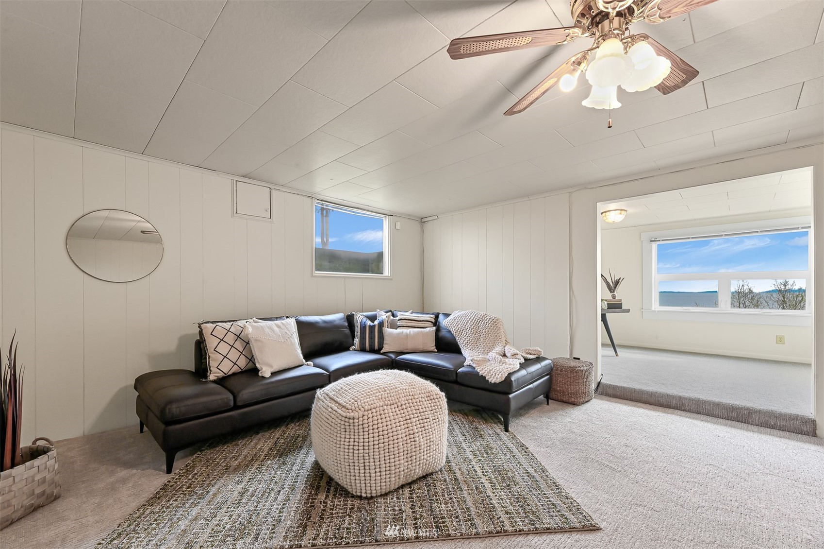 3796 Bancroft Road Bellingham, WA 98225 - Photo 23 of 38 a living room with furniture and a chandelier