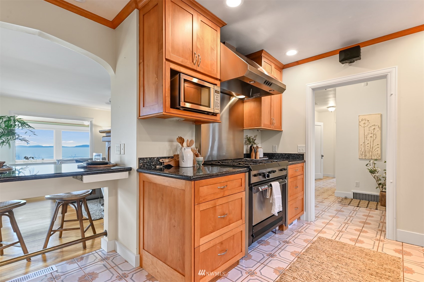 3796 Bancroft Road Bellingham, WA 98225 - Photo 10 of 38 a kitchen with stainless steel appliances granite countertop a stove a sink and a refrigerator