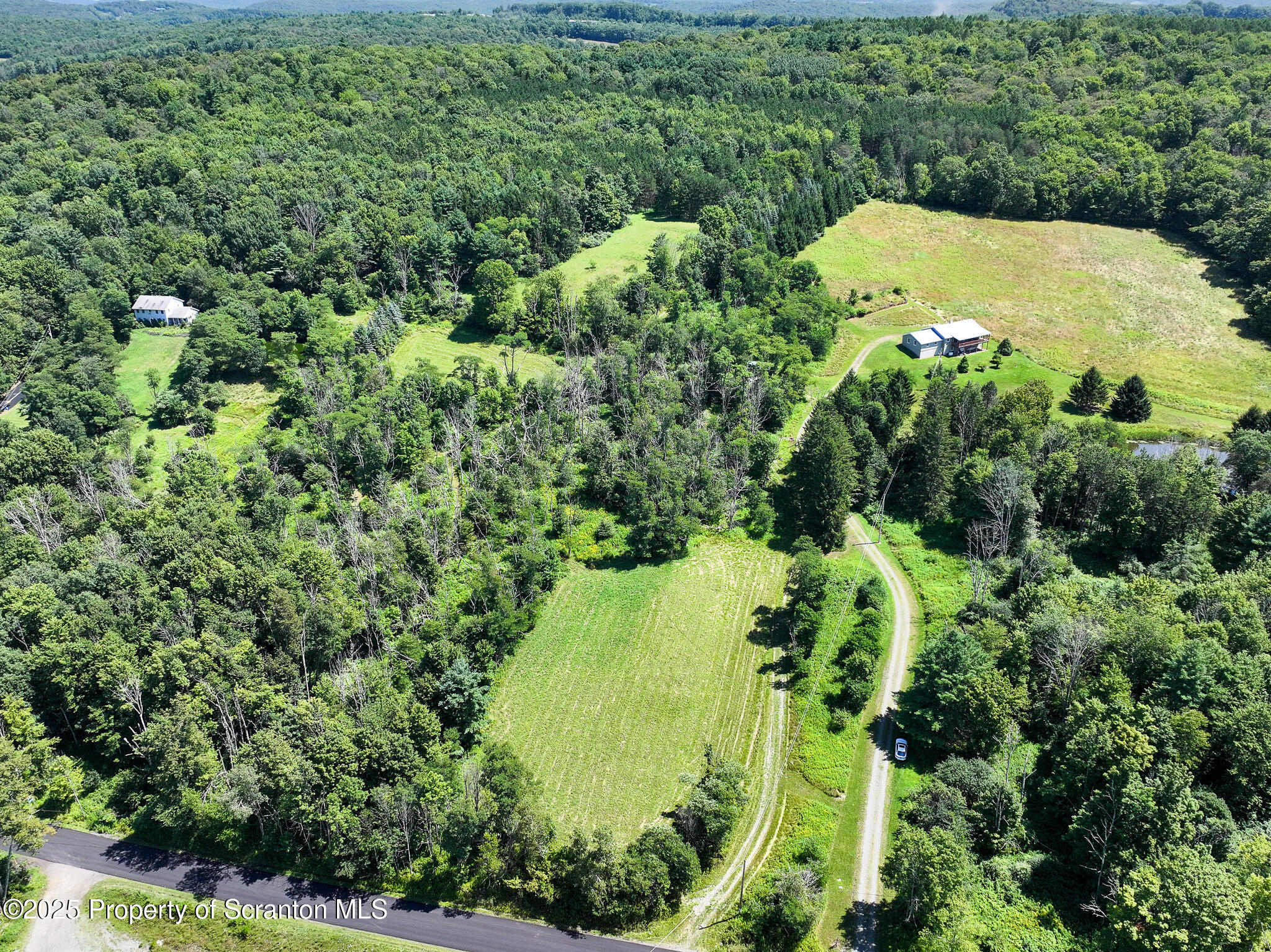 5290 Irish Hill Road Montrose, PA 18801 - Photo 56 of 67 an aerial view of a house with a yard