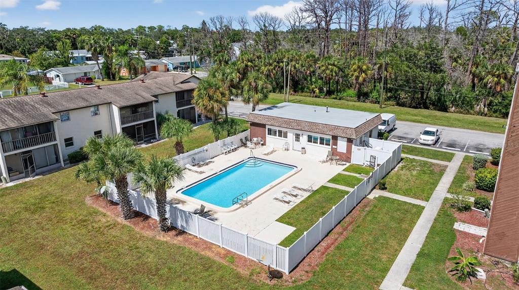 5541 Bay Boulevard, Unit 203 Port Richey, FL 34668 - Photo 27 of 30 an aerial view of a house with a big yard