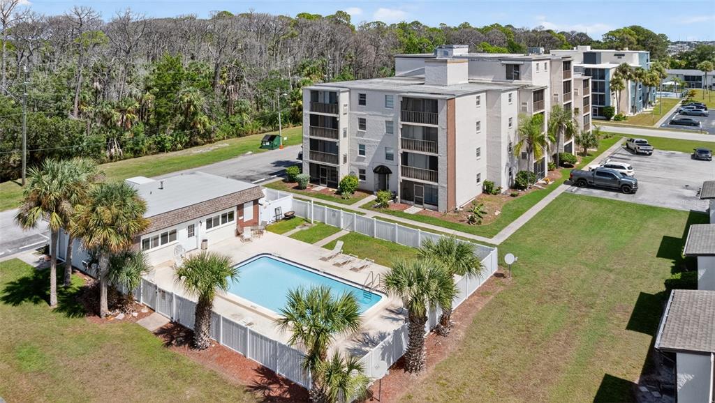 5541 Bay Boulevard, Unit 203 Port Richey, FL 34668 - Photo 28 of 30 a view of a house with a yard and sitting area