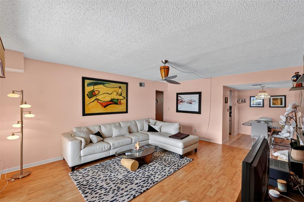 5541 Bay Boulevard, Unit 203 Port Richey, FL 34668 - Photo 5 of 30 a living room with furniture and a rug