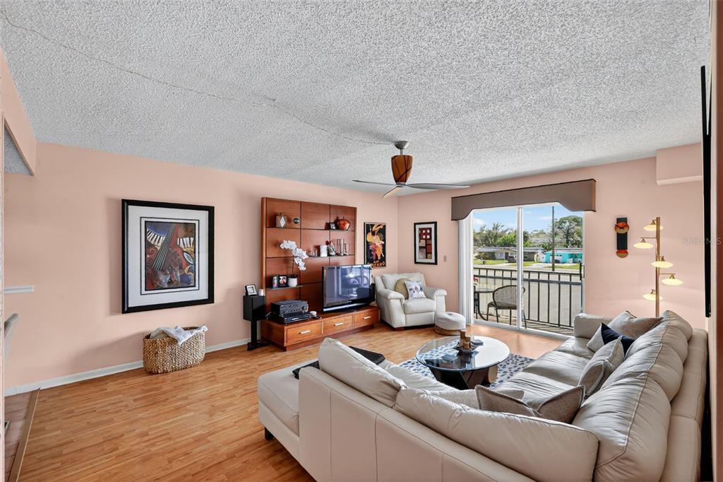 5541 Bay Boulevard, Unit 203 Port Richey, FL 34668 - Photo 6 of 30 a living room with furniture and a large window