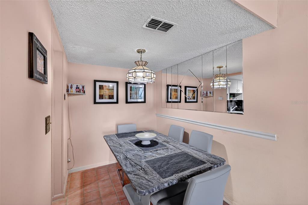 5541 Bay Boulevard, Unit 203 Port Richey, FL 34668 - Photo 9 of 30 a living room with furniture and a table