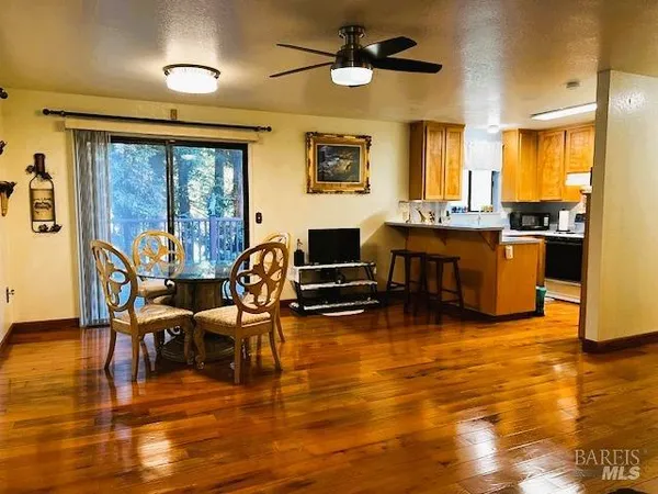 a kitchen with refrigerator and window