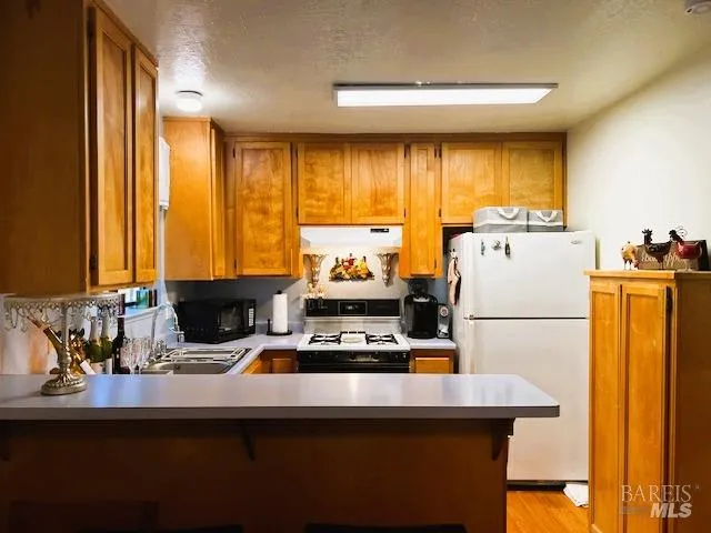 a living room with a fireplace and a rug
