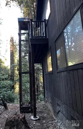 a view of balcony with wooden floor
