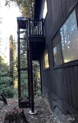 a view of balcony with wooden floor
