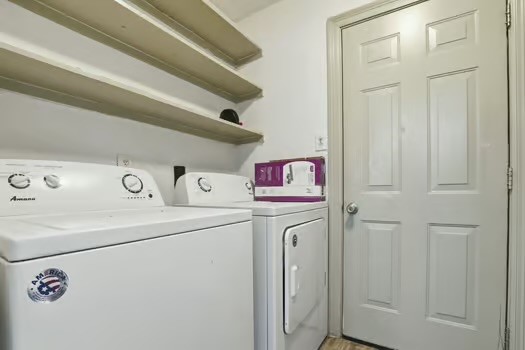 703 Reseda Drive Houston, TX 77062 - Photo 15 of 25 a utility room with dryer and washer