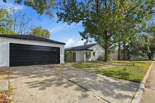 a house with trees in the background