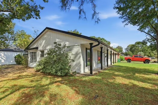 703 Reseda Drive Houston, TX 77062 - Photo 4 of 25 a view of a house with a yard