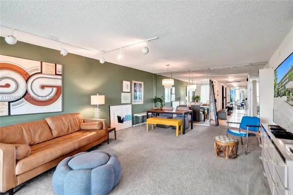 a kitchen with a refrigerator a sink and cabinets