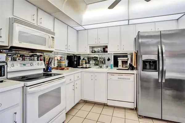 a view of a balcony with chairs and a table