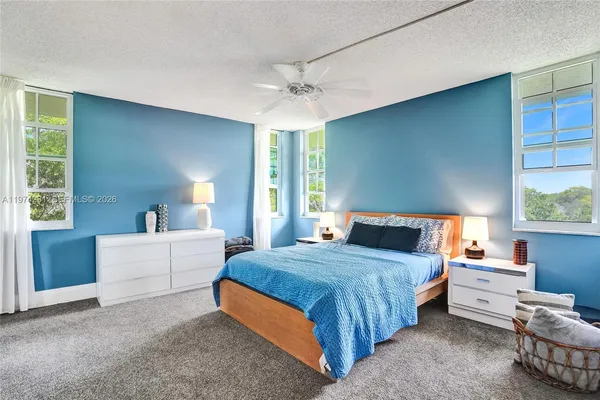 a bathroom with a toilet a sink and a mirror