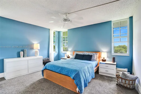 a bathroom with a toilet a sink and a mirror