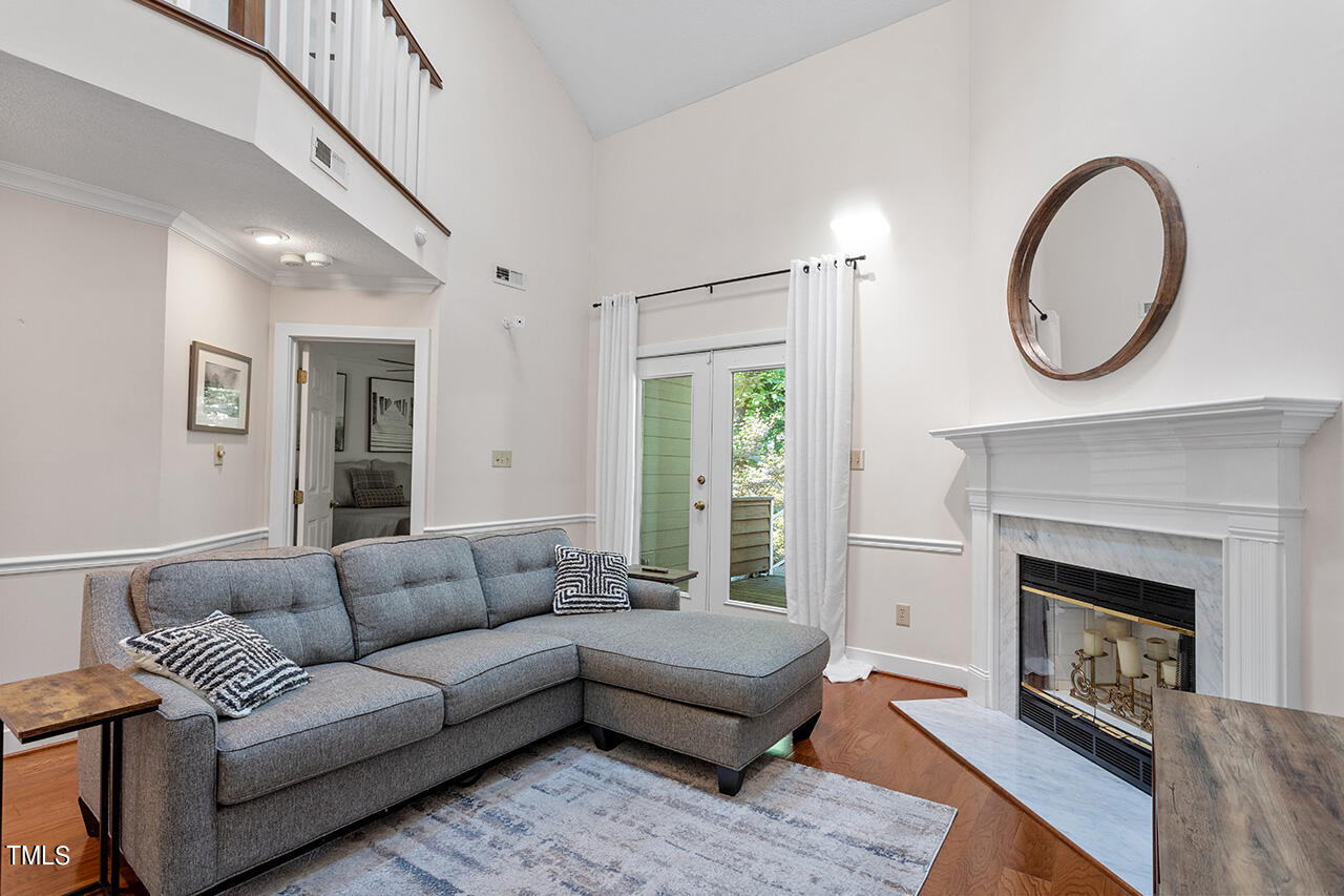 1433 Quarter Point Raleigh, NC 27615 - Photo 11 of 27 a living room with furniture and a fireplace