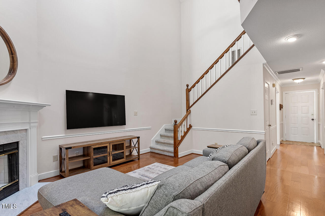 1433 Quarter Point Raleigh, NC 27615 - Photo 13 of 27 a living room with furniture and a flat screen tv