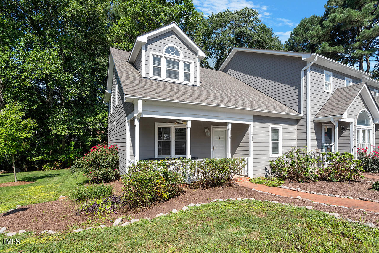 1433 Quarter Point Raleigh, NC 27615 - Photo 2 of 27 a front view of a house with a yard and trees