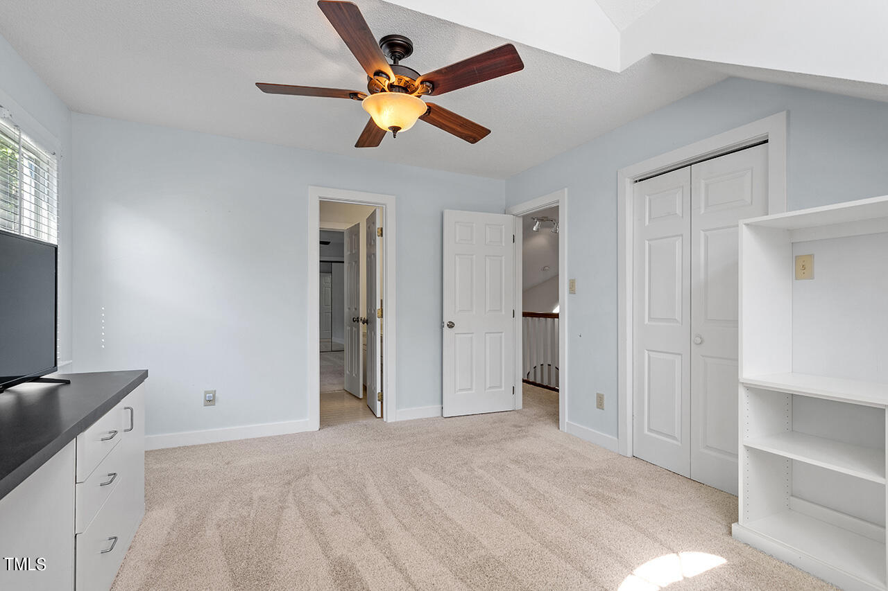 1433 Quarter Point Raleigh, NC 27615 - Photo 21 of 27 a view of empty room with window and ceiling fan