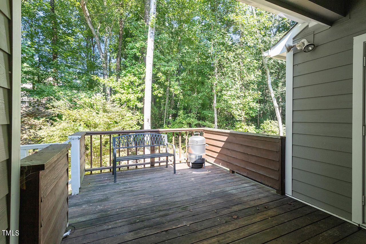 1433 Quarter Point Raleigh, NC 27615 - Photo 26 of 27 a view of balcony with wooden floor and fence
