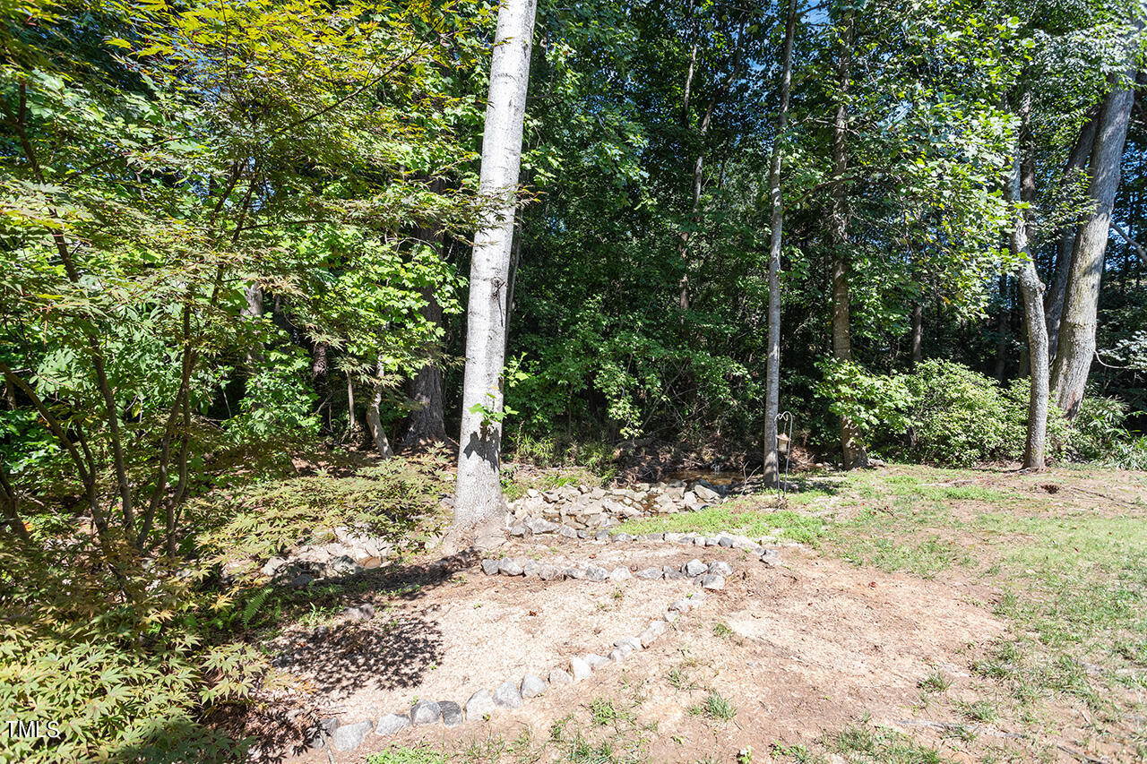 1433 Quarter Point Raleigh, NC 27615 - Photo 27 of 27 a view of a yard with plants and trees