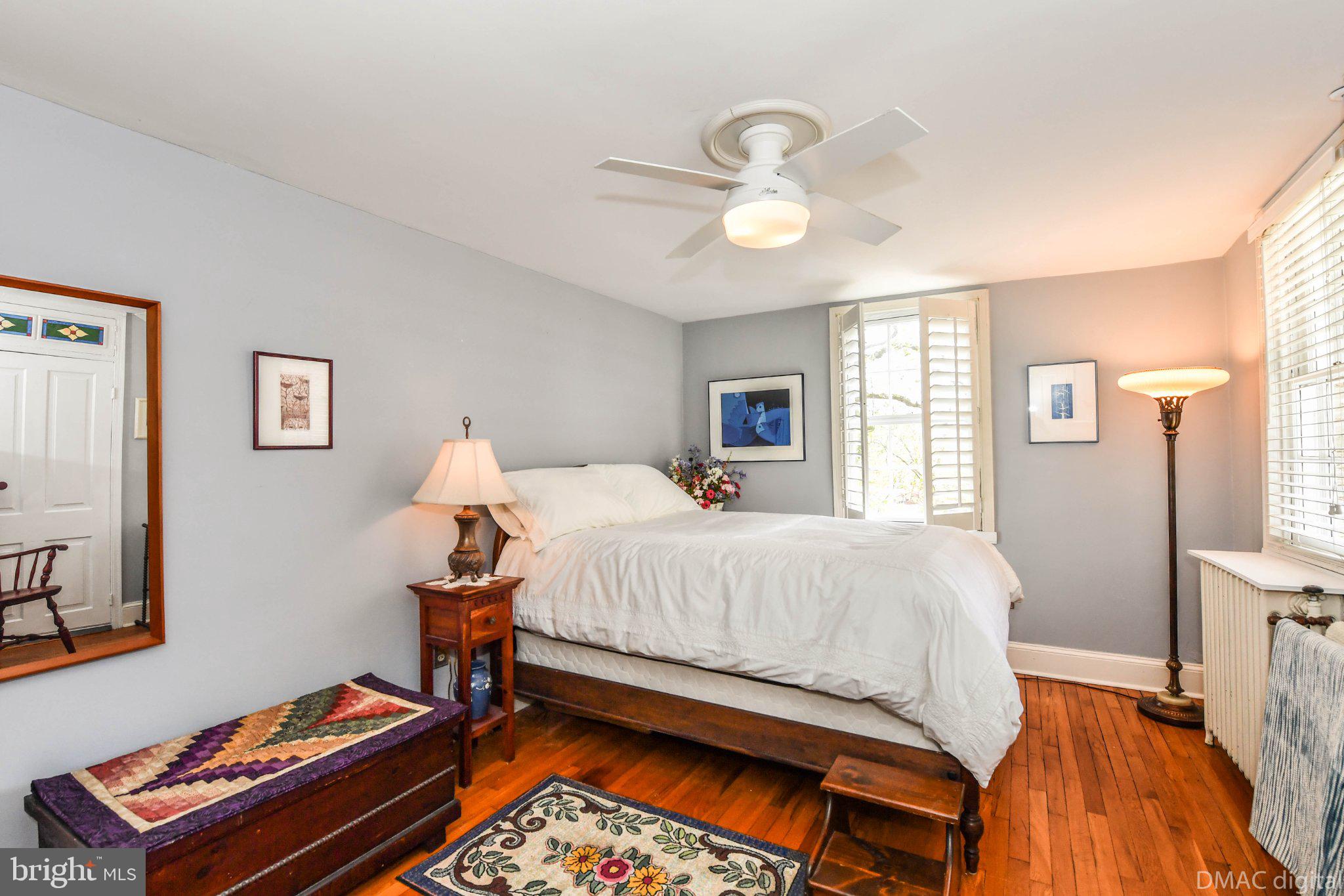 106 West 3rd Street Frederick, MD 21701 - Photo 13 of 46 a bedroom with a bed and wooden floor