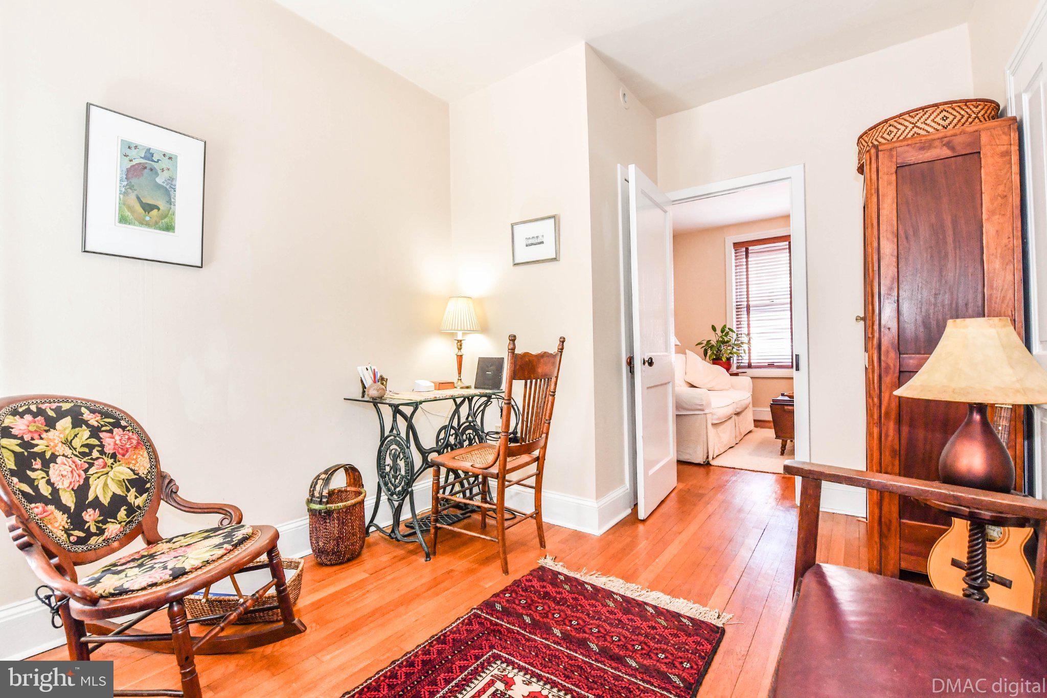 106 West 3rd Street Frederick, MD 21701 - Photo 21 of 46 a living room with furniture a rug and a table