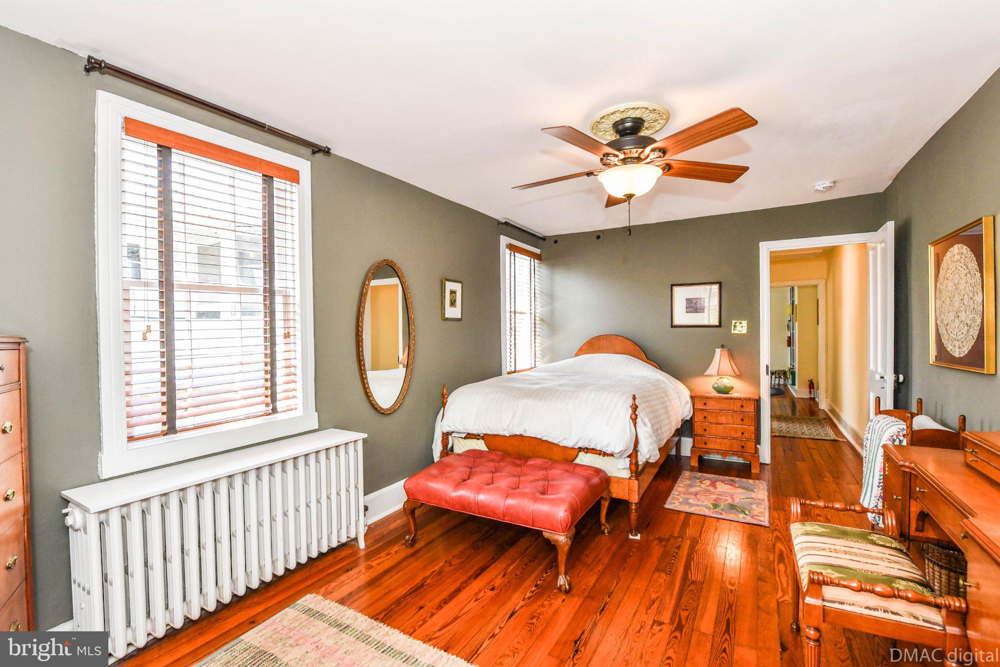 106 West 3rd Street Frederick, MD 21701 - Photo 27 of 46 a bedroom with a bed and a chandelier