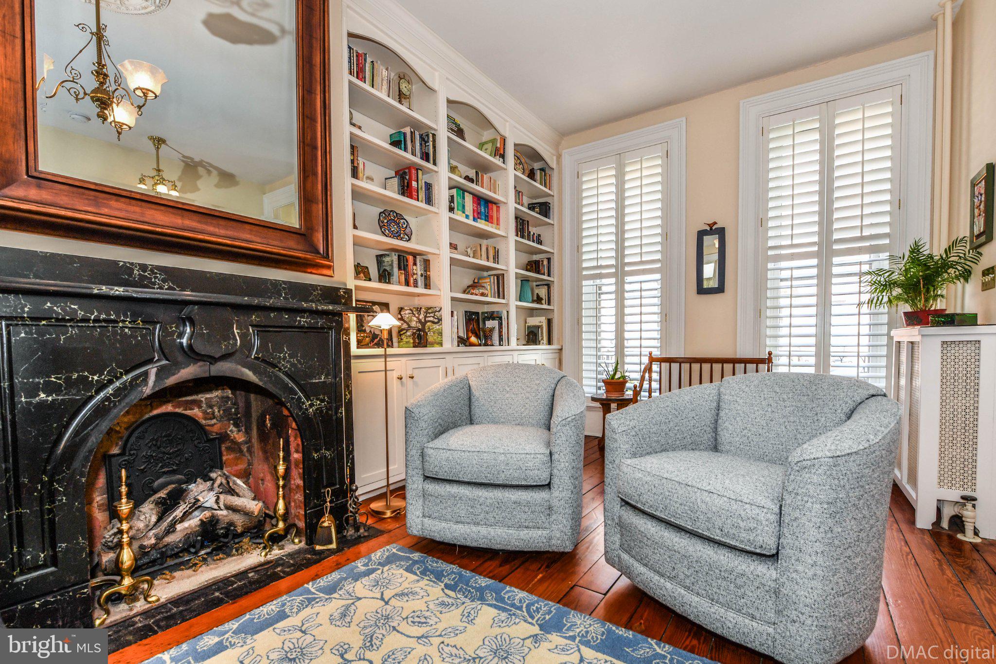 106 West 3rd Street Frederick, MD 21701 - Photo 3 of 46 a living room with furniture and a fireplace