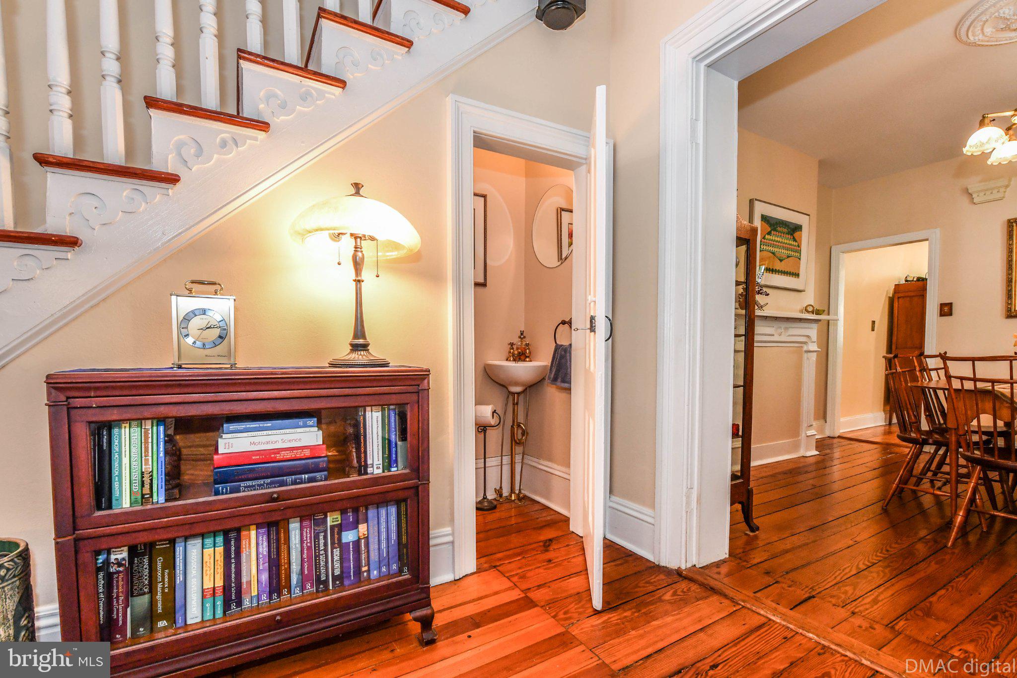 106 West 3rd Street Frederick, MD 21701 - Photo 5 of 46 a view of a hallway with wooden floor and entryway
