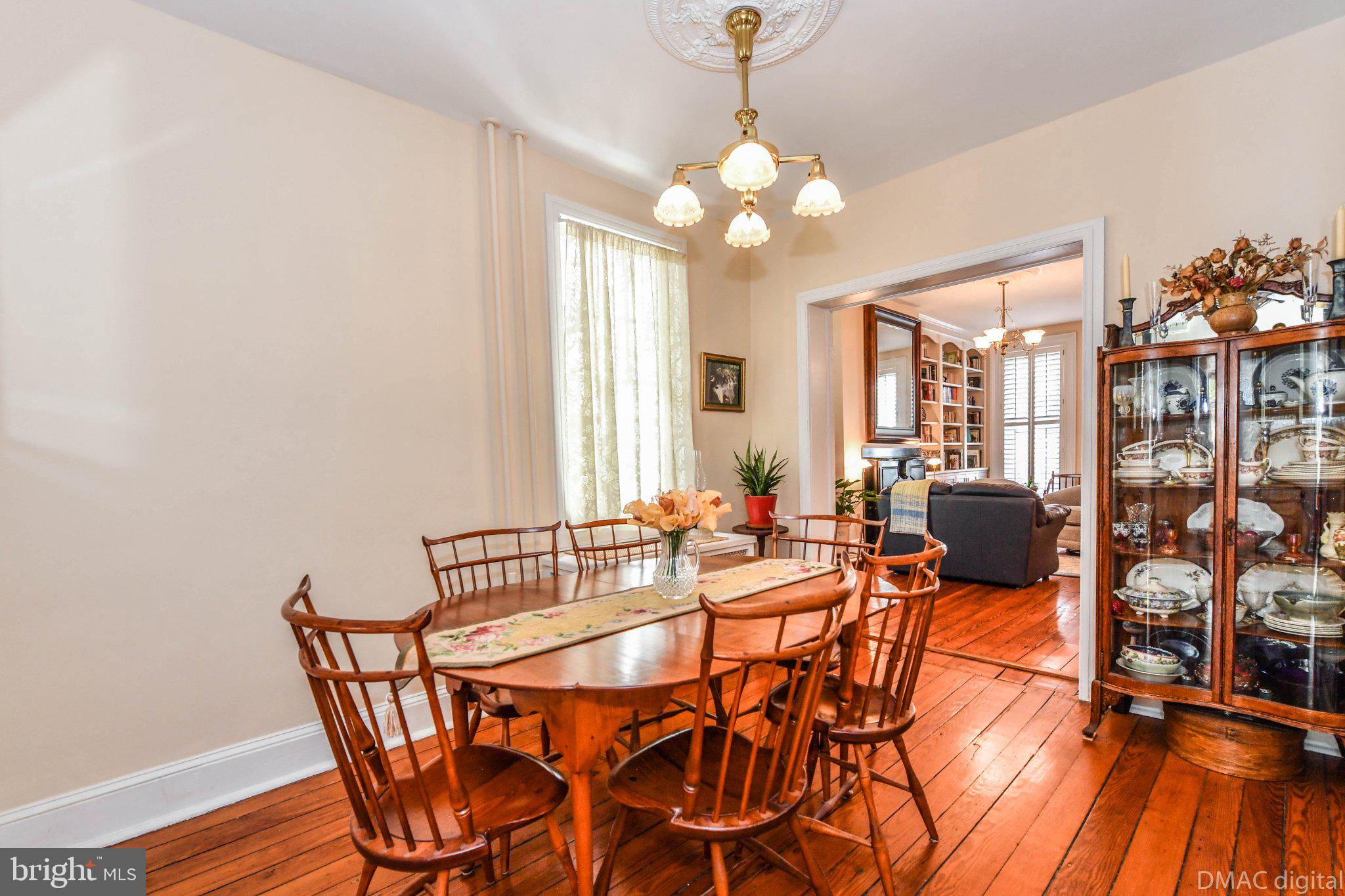 106 West 3rd Street Frederick, MD 21701 - Photo 6 of 46 a view of a dining room with furniture and chandelier