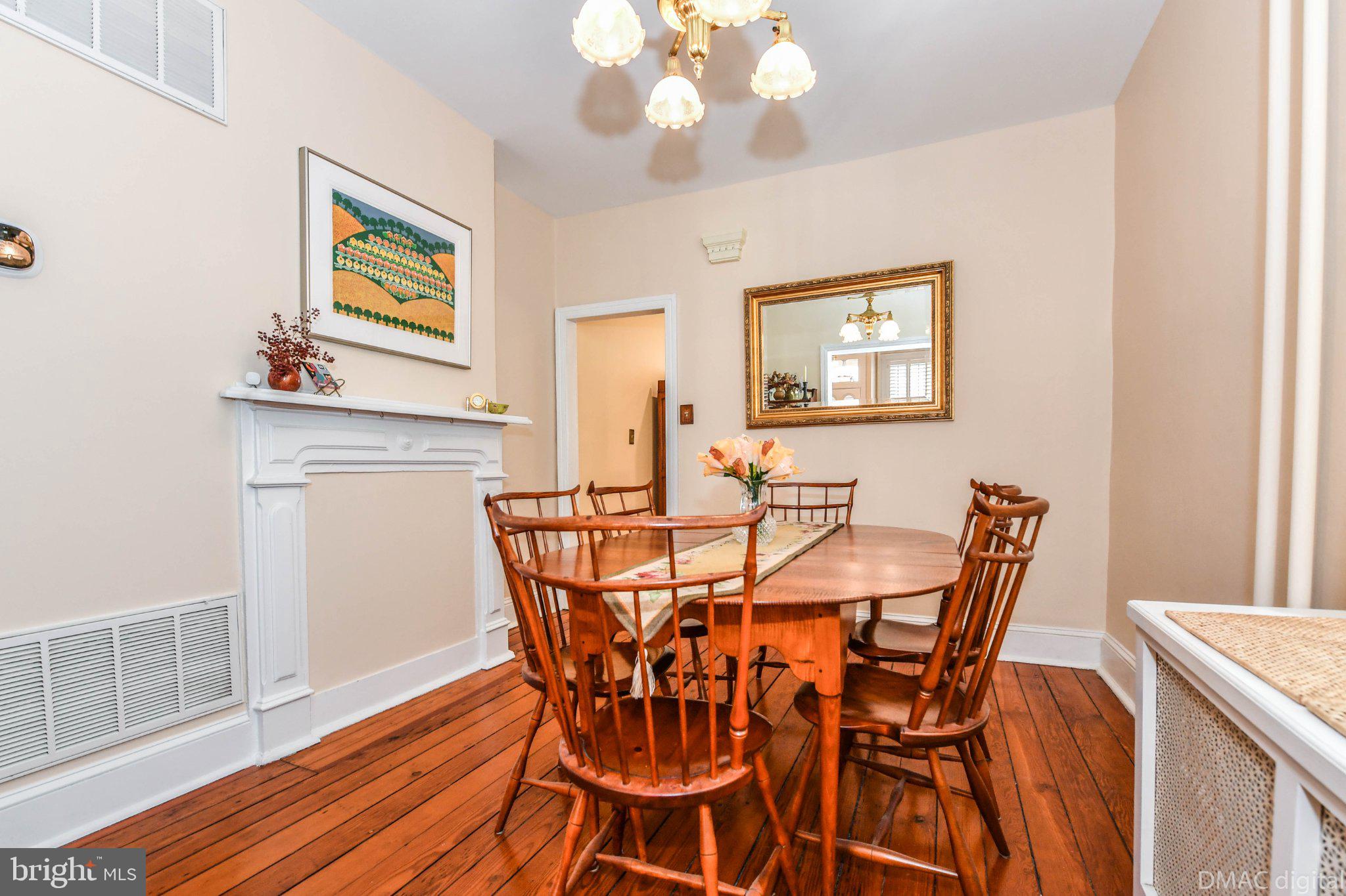 106 West 3rd Street Frederick, MD 21701 - Photo 7 of 46 a view of a dining room with furniture and wooden floor