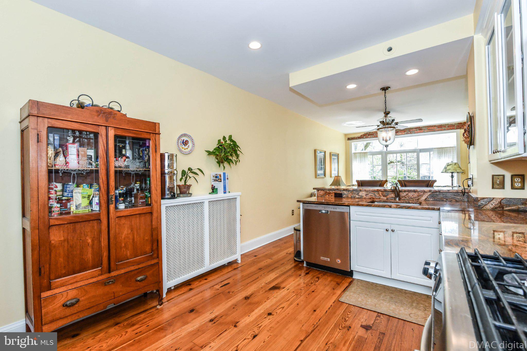 106 West 3rd Street Frederick, MD 21701 - Photo 10 of 46 a kitchen with stainless steel appliances granite countertop a stove and cabinets