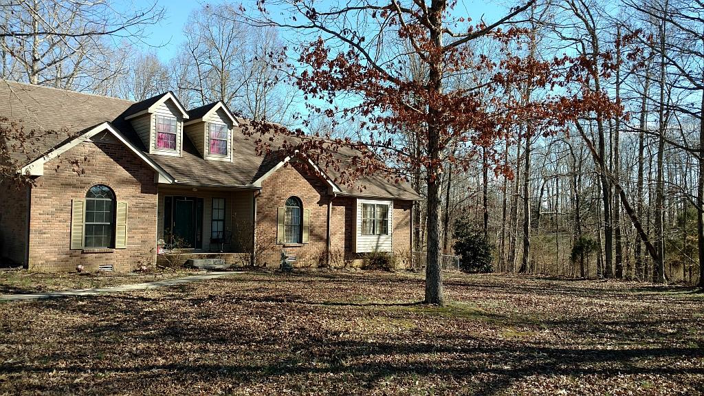 4859 Marion Road Cunningham, TN 37052 - Photo 1 of 10 a front view of a house with a yard