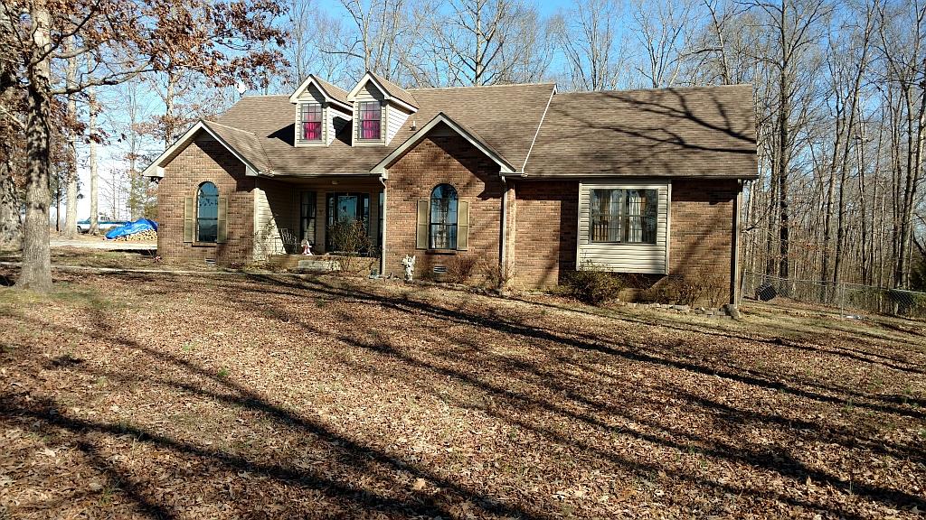 4859 Marion Road Cunningham, TN 37052 - Photo 4 of 10 a front view of a house with a yard