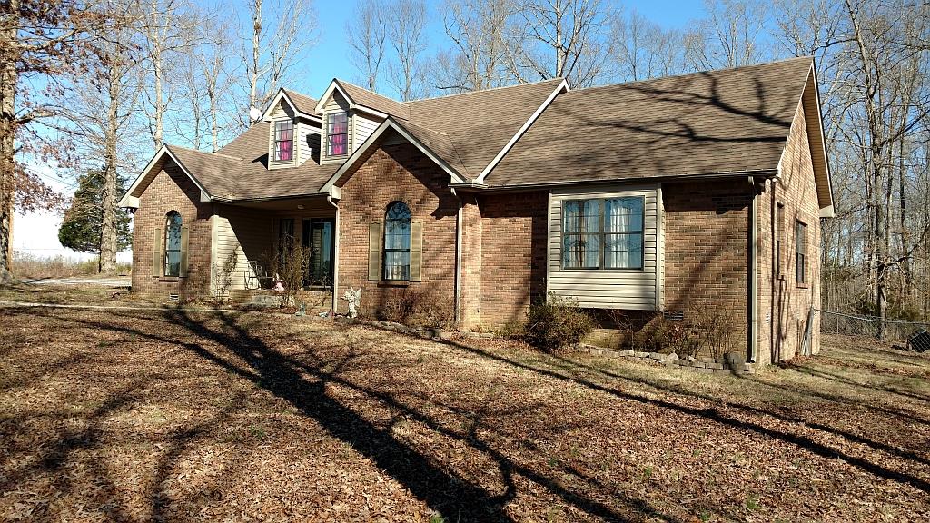 4859 Marion Road Cunningham, TN 37052 - Photo 7 of 10 a view of a house with wooden fence