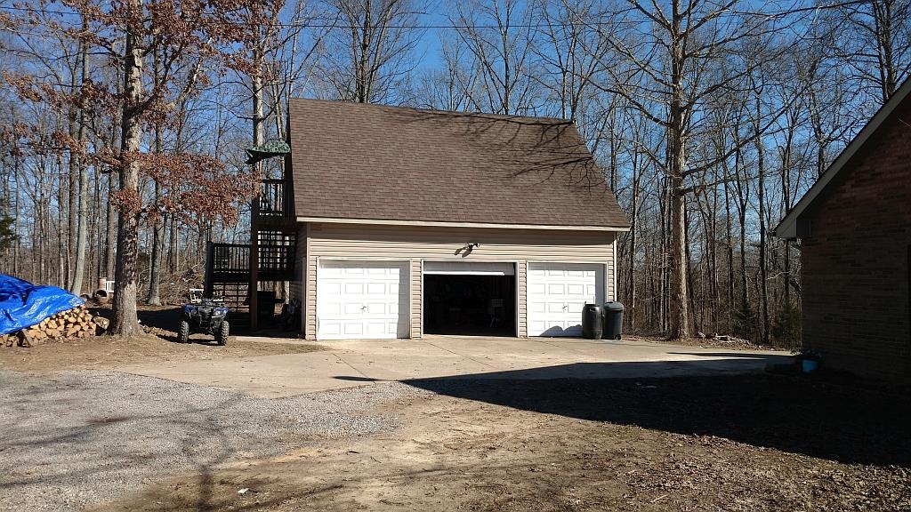 4859 Marion Road Cunningham, TN 37052 - Photo 9 of 10 a view of a building with a yard