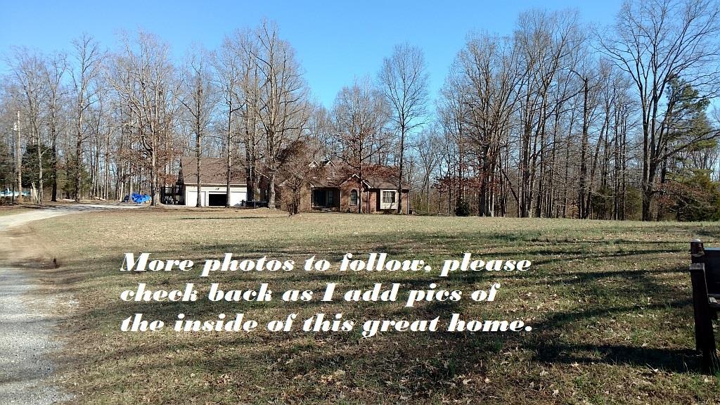 4859 Marion Road Cunningham, TN 37052 - Photo 10 of 10 a view of a yard with a bench