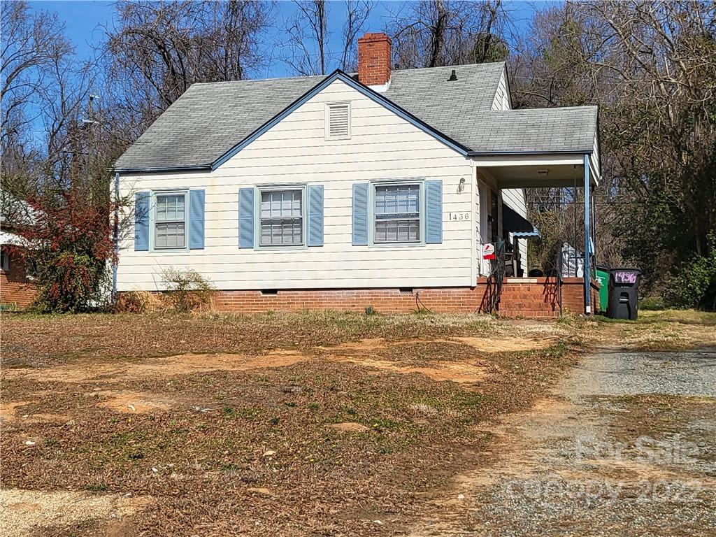 1436 Kimberly Road Charlotte, NC 28208 - Photo 2 of 6 a front view of a house with a yard
